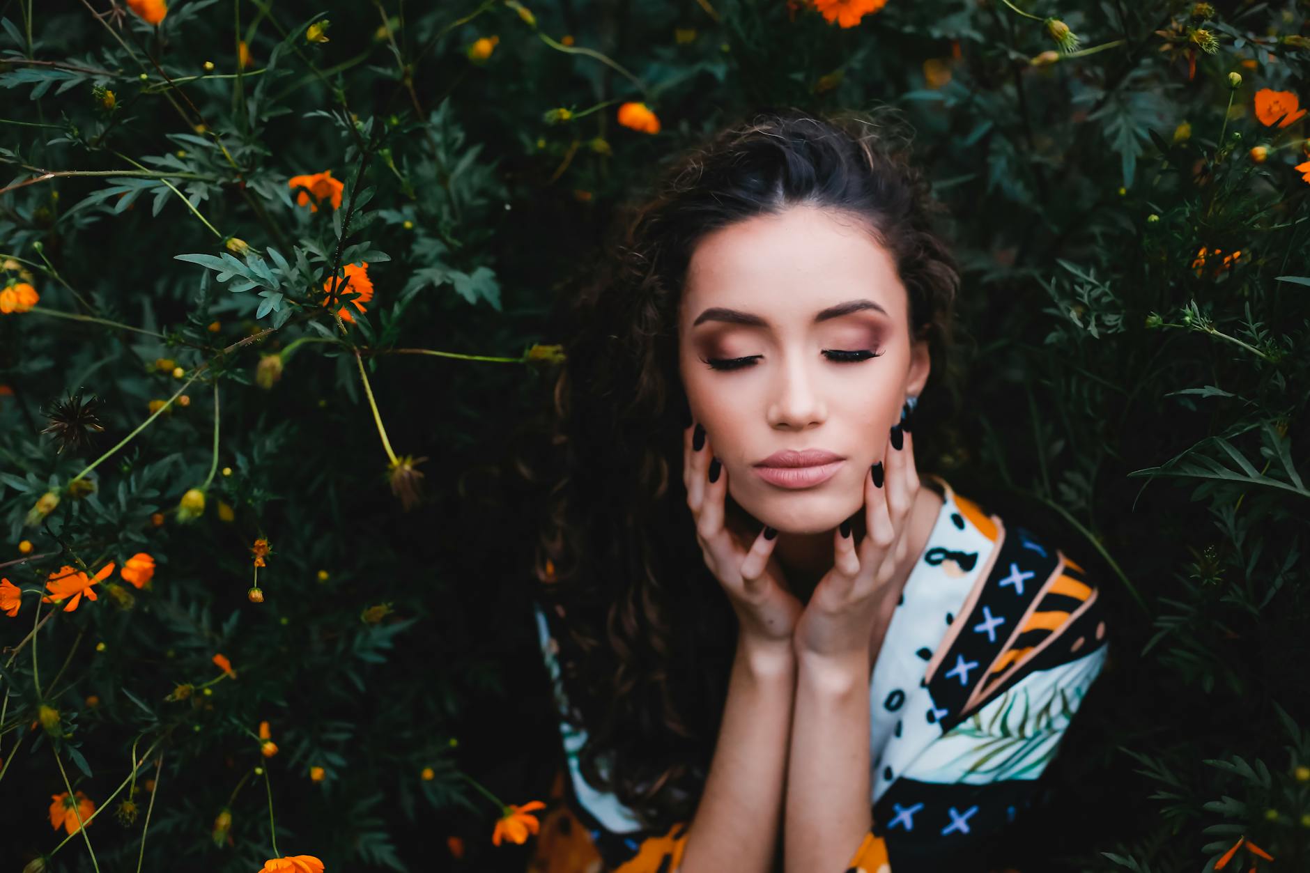woman beside plants